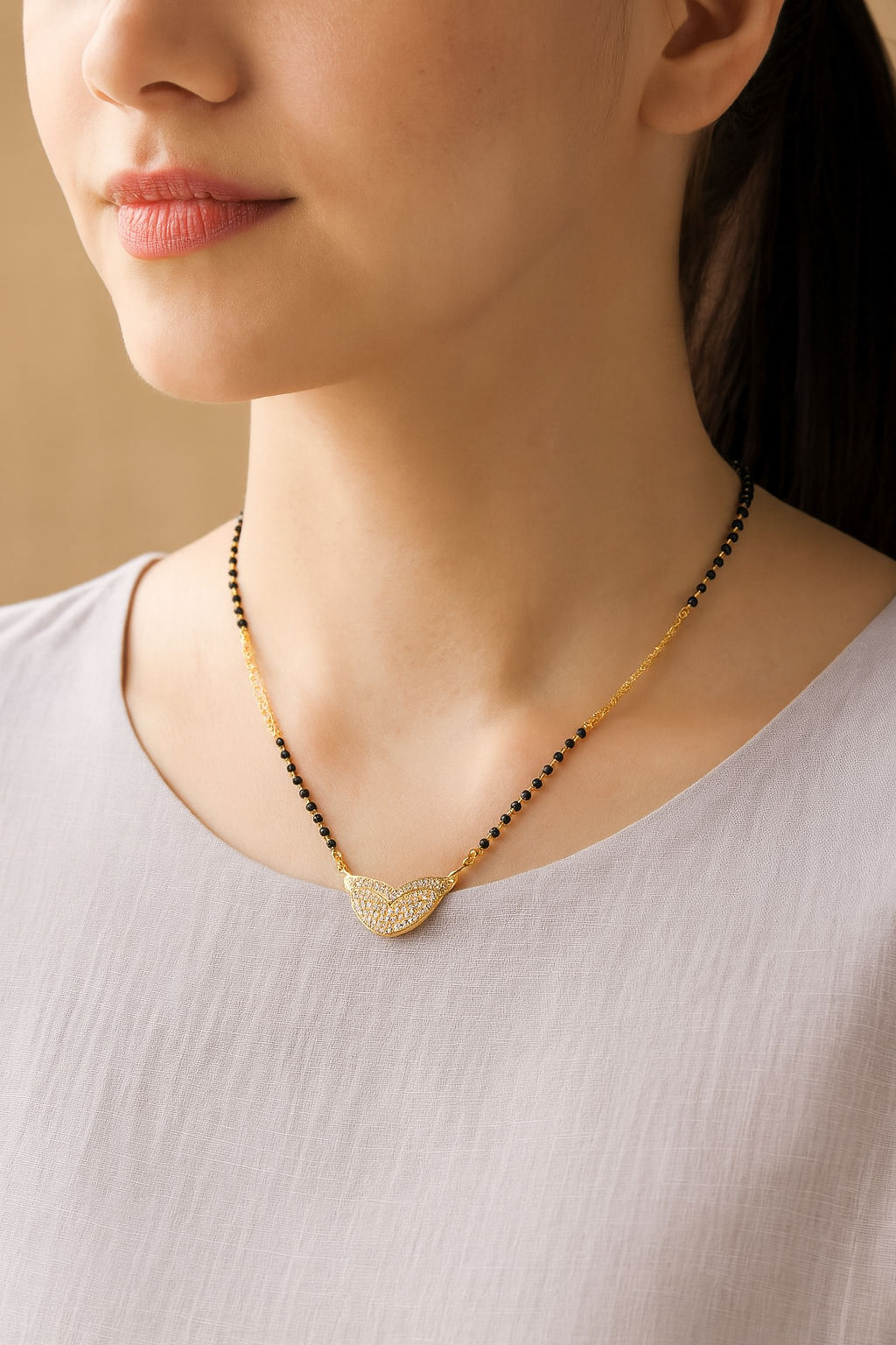 Elegant Gold-Plated Mangalsutra with Black Beads & CZ-Studded Chevron Pendant